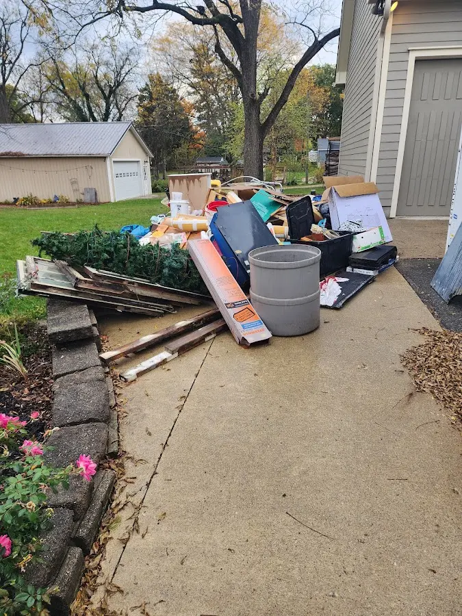 Dumpster being loaded with debris for 10 Yard Dumpster Rental in Lehigh